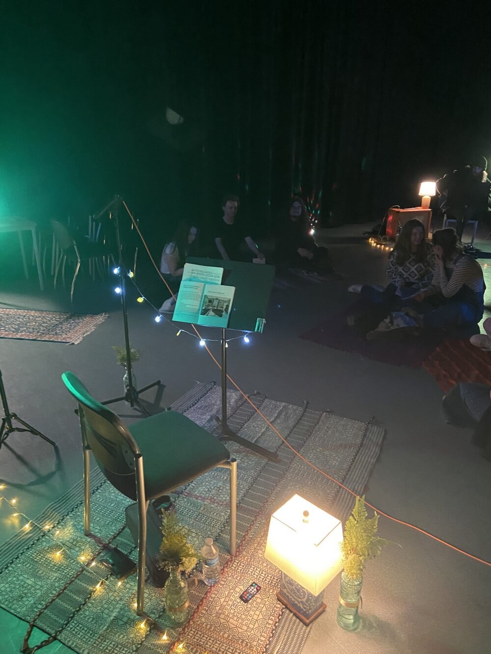 Kathryn performing with flute, projection behind
